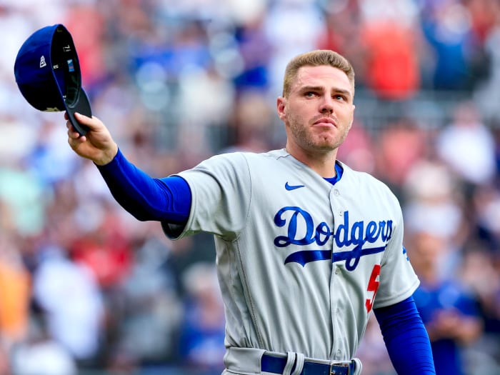 Los Angeles Dodgers first baseman Freddie Freeman walks to the field for the presentation of his World Series championship ring, before the team’s baseball game against the Atlanta Braves on Friday, June 24, 2022 in Atlanta.